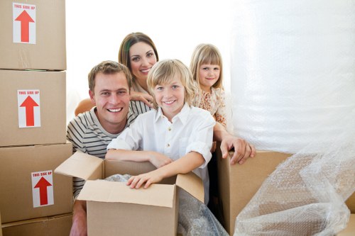 Packers carefully organizing items for a move