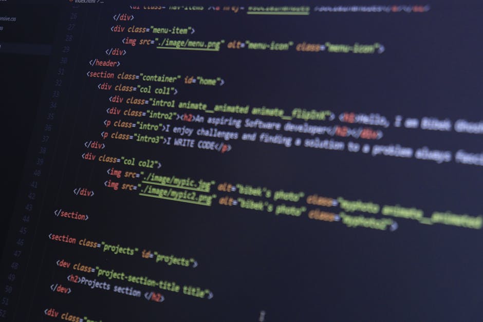 Close-up image of a computer screen displaying multi-coloured lines of HTML and CSS code, with some sections highlighted in red and green. The code is slightly blurred, with the focus on the central p